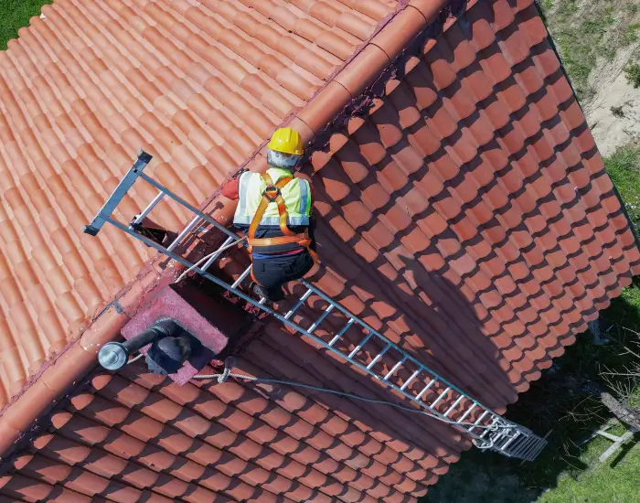 Two Technicians Installing Tile Roofing at a Residential House in St. Augustine, Florida

